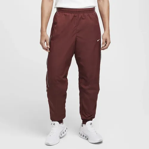 Nike Solo Swoosh чоловічі спортивні штани колір коричневий