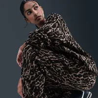 Nike Sportswear Phoenix Fleece женская С высокой Талией оверсайз Printed Sweatpants цвет черный
