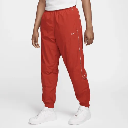 Nike Solo Swoosh чоловічі спортивні штани колір червоний