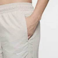 Nike Sportswear Collection жіноча Mid-Rise Repel Zip Pants колір сірий