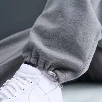 Nike Solo Swoosh чоловічі Fleece Open-Hem Pants колір сірий