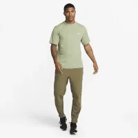 Nike A.P.S. мужские Dri-FIT ADV Woven Versatile Pants цвет зеленый