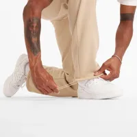 Штани New Balance MP44587SNW - Бежевий