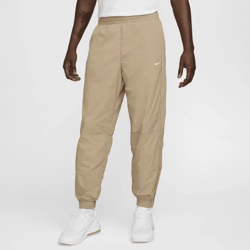 Nike Solo Swoosh чоловічі спортивні штани колір коричневий